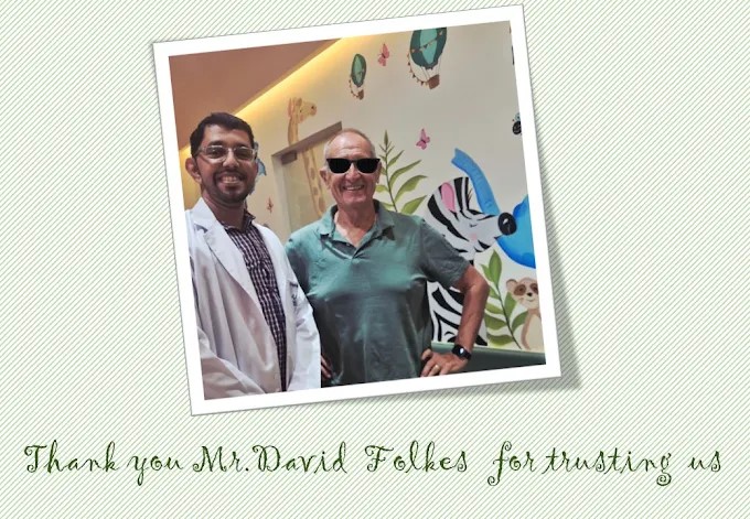 Satisfied international dental patient Mr. David Folkes smiling alongside his treating dentist at Doctor Dental Care.